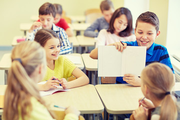 Sticker - group of school kids writing test in classroom