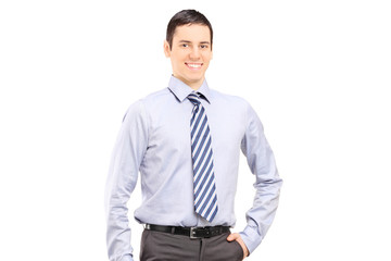 Wall Mural - Young confident businessman posing