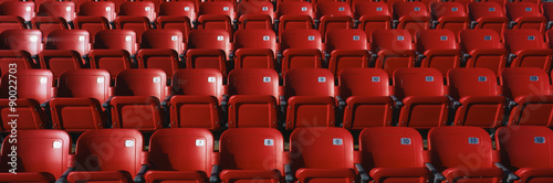 Fotografie, Obraz These are bright red outdoor stadium seats with seats that fold up