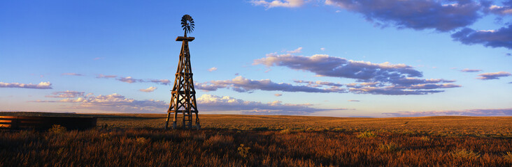 This is an old wooden windmill along Route 60. It is an RMotor windmill in sunset light.