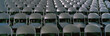 © spiritofamerica - These are empty, grey folding chairs awaiting the crowd to attend the U.S. Naval Academy, Graduation Ceremony. They are neatly set up in rows side by side.