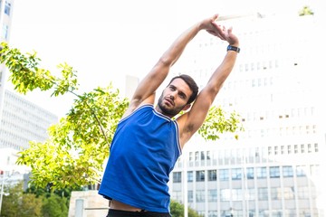 Poster - Handsome athlete stretching 