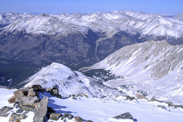 Wall Mural - Snow capped mountain peaks in alpine scene after snow storm