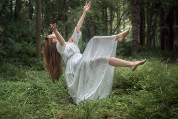 floating girl in the forest
