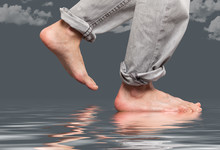 Close Up Of Feet Walking By The Water