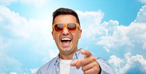 Poster - face of laughing man in sunglasses pointing to you