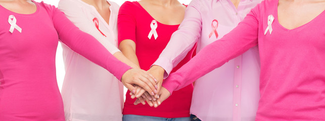 Wall Mural - close up of women with cancer awareness ribbons