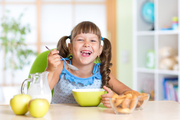 kid eating healthy food at home