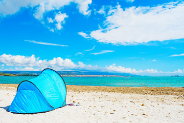 blue tent by the sea in alghero