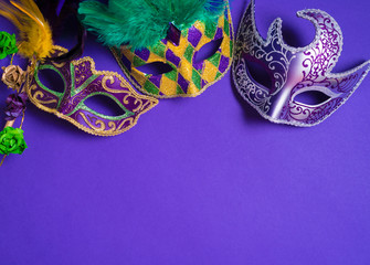 Mardi Gras or carnival mask on purple background