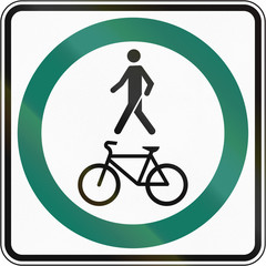 Wall Mural - Regulatory road sign in Quebec, Canada - Shared use path with single lane