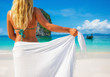 Woman with sarong on caribbean beach