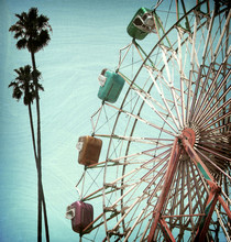 Aged And Worn Vintage Photo Of Ferris Wheel And Palm Trees