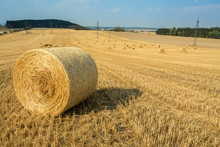 Beautiful Landscape With Straw Bales In Harvested Fields