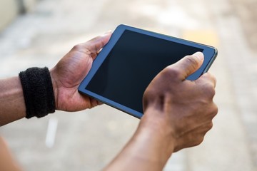 Poster - Athletic man using tablet computer