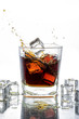 © pixs4u - Ice cube droped in cola glass and cola splashing