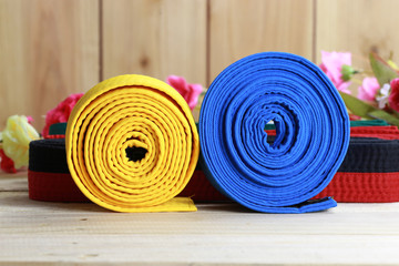 Color belt of martial art on wood floor