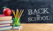 © Romolo Tavani - back to school - apple on books with pencils and blackboard