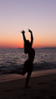 © flaviosilva86 - Woman practicing Yoga, sunset in the beach