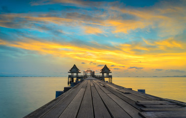 Wooded bridge in the port and sunset