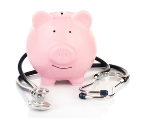 Poster - Piggy bank with stethoscope isolated on white