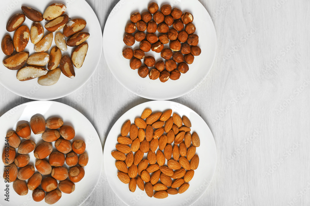 Collection of nuts on wooden background