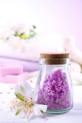 Poster - Spa treatment and flowers on wooden table, on light background