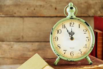 Poster - Clock and vintage books, on rustic wooden background