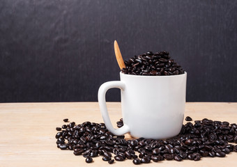 Fresh coffee in a cup of coffee on wooden