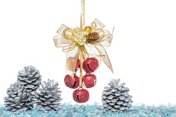 luxury red jingle bells and pine cone with snow