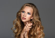 © FoodAndPhoto - Beautiful Woman with Curly Long Hair