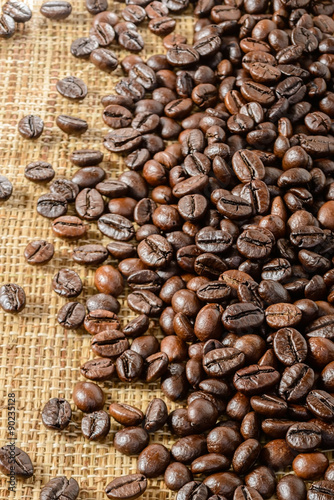 Fototapeta na wymiar roasted coffee beans on burlap mat
