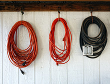 Extension Power Cords On The Wall Of Working Shop