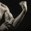 © Volodymyr - Male biceps and syringe