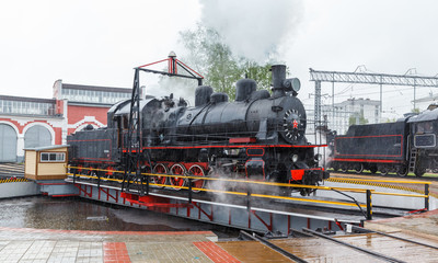 old black steam locomotive in Russia 