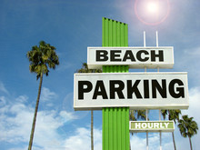 Aged And Worn Vintage Photo Of Beach Parking Sign With Palm Trees