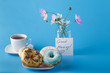 Donuts on saucer with note Good morning