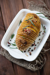 Sticker - Hasselback potato with various herbs and spices, high angle view