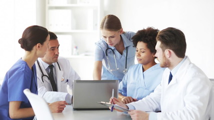 Wall Mural - group of doctors with laptop meeting at hospital