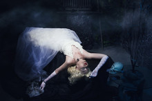 Sleeping Beauty. Beautiful Lifeless Bride In White Dress Lying O