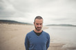 © ramonespelt - Man looking down on the beach