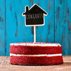 Poster - house-shaped chalkboard with the text congrats in a cake, with a