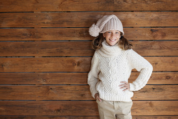 Canvas Print - Child posing in knitted clothing