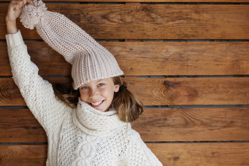 Wall Mural - Child posing in knitted clothing