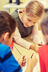 Poster - group of students talking and writing at school