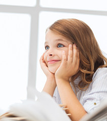 Canvas Print - student girl writing in notebook at school