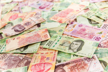 Mexican money background / selective focus