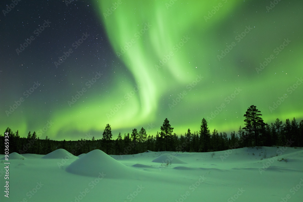 Aurora borealis over snowy winter landscape, Finnish Lapland - obrazy, fototapety, plakaty 