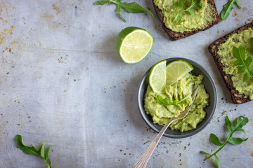 Sticker -  guacamole and rye toasts on rustic  background