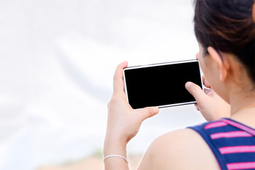 Poster - women hand holding the smartphone
